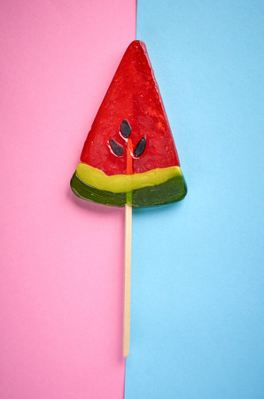 Home made sugar candy, sweet dessert on stick, flat lay composition and top view photoの写真素材