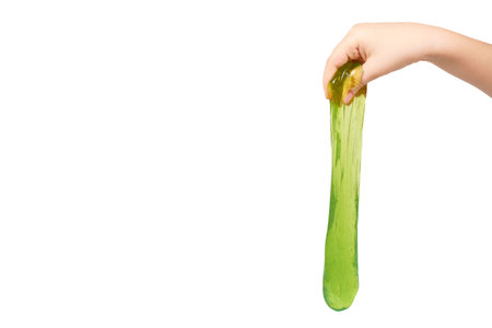 teenager playing green slime with hand, transparent toy. Isolated on white background. Copy space...