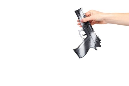 Hand with black gun, side view pistol, crime and military concept. Isolated on white background. Copy space templateの写真素材