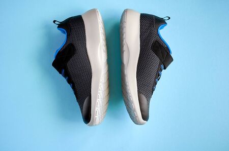 Sneakers on blue background composition, shoes for run. Flat lay and top view photoの写真素材