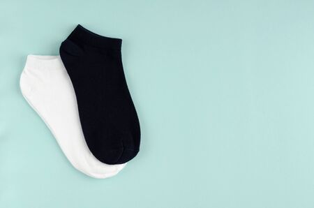 Kids socks composition on blue background. Flat lay, layout and tabletop mockup with copy space.の写真素材