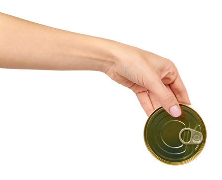 Hand with can. Canned prepared food with opener, conserved snack. Isolated on white background.