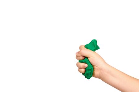 Children hand with color plasticine, kids educational toy. Isolated on white background. Copy space template, mockup.の写真素材