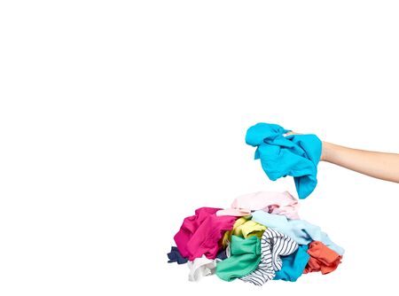 Hand with assorted clothes, loundry housework. Isolated on white background. Copy space template, mockup.の写真素材