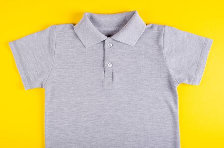 Textile, shirt composition on color background. Flat lay, layout and tabletop mockup with copy space.の写真素材