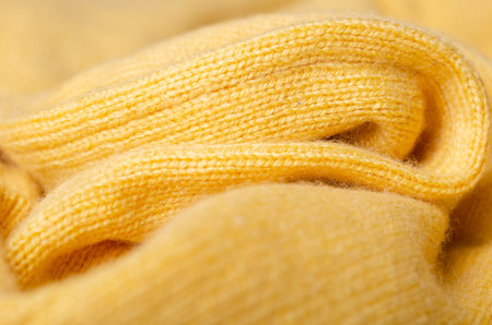 Yellow textile and texture background. Fabric macro photography, cloth pattern.の写真素材