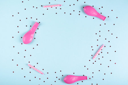 Pink air balloons composition on blue background, party and celebration decoration. Flat lay, layout...