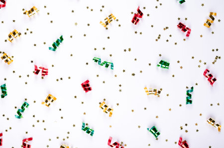 Colored confetti composition on gray background, party and celebration decoration. Flat lay, layout...