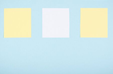 Paper notes composition on blue background. Flat lay, layout and tabletop mockup with copy space.の写真素材