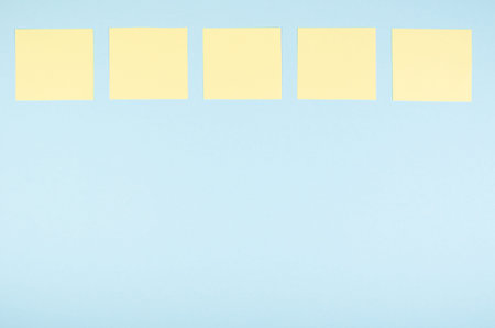 Paper notes composition on blue background. Flat lay, layout and tabletop mockup with copy space.