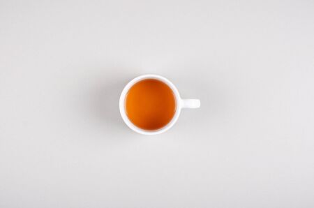 Tea cup composition on gray background. Flat lay, layout and tabletop mockup with copy space.の写真素材