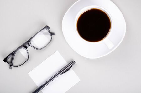 Coffee cup composition on gray background. Flat lay, layout and tabletop mockup with copy space.の写真素材