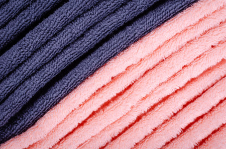 Blue and pink towel fabric texture, top view photo, copy space background.