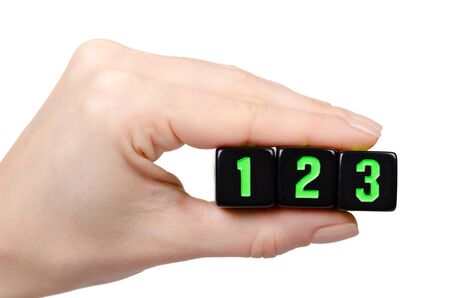 Hand with black dices for games. Isolated on white background.の写真素材