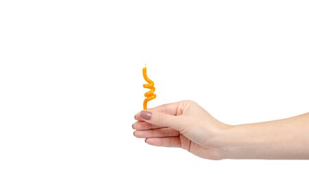 Hand with birthday cake candle, party decoration, fun and happy. Isolated on white background. Copy space, template.の写真素材