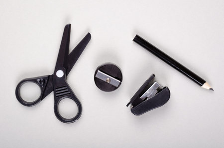 School supply on gray background composition. Flat lay and top view photo with copy space.