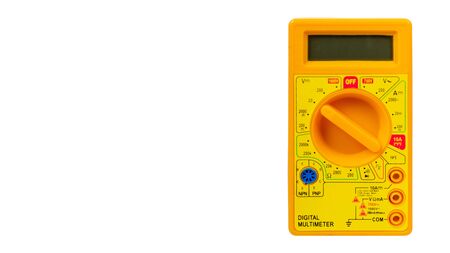 Yellow plastic multimeter, electric tester tool. Isolated on white background. Copy space, template.の写真素材