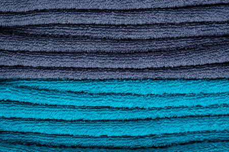 Blue towel fabric texture, top view photo, copy space background.