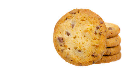 Round cookie with chocolate drops. Isolated on white background. Copy space, template.