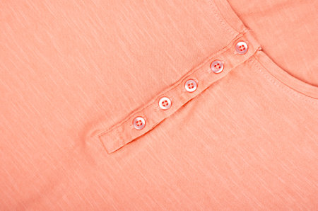 Coral textile and texture background. Fabric macro photography, cloth pattern.