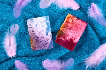 Spa concept idea,towel and soap composition on blue background. Flat lay.の写真素材