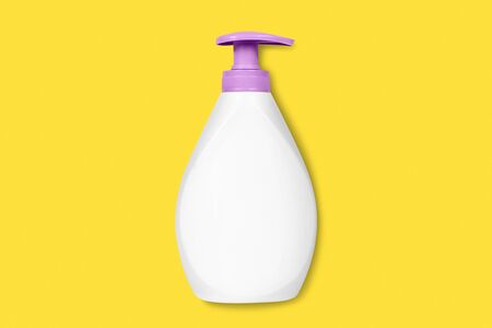 Liquid soap bottle on yellow background. Flat lay.の写真素材
