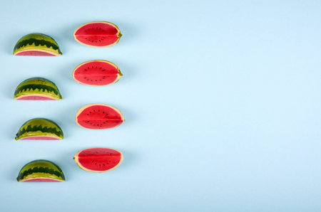 Watermelon slices composition on color background. Flat lay and overhead image. Copy space.