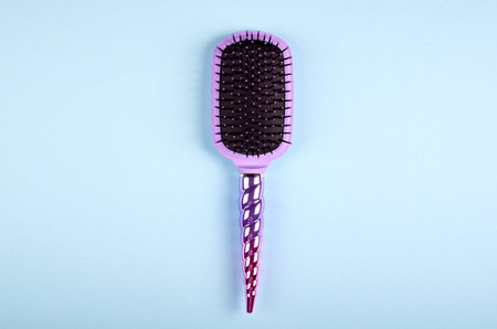 Hair comb on color background, fashion idea. Flat lay and overhead image. Copy space.