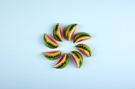 Watermelon slices composition on color background. Flat lay and overhead image. Copy space.の写真素材