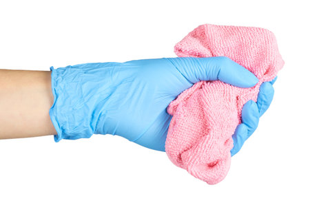 Colored cleaning rag with hand in rubber glove. Isolated on white background.