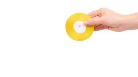 Hand with color satin ribbon. Isolated on white background. Copy space, template.の写真素材