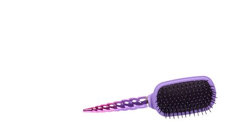 Purple hairbrush, hair care and beauty. Isolated on white background. Copy space, template.の写真素材