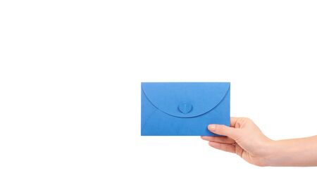 Hand with blank mail envelope with heart. Isolated on white background. Copy space, template.の写真素材