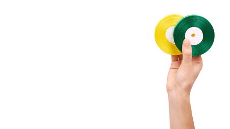 Hand with color satin ribbon. Isolated on white background. Copy space, template.の写真素材
