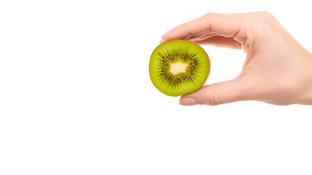 Hand with fresh and ripe kiwi slice. Isolated on white background. Copy space, template.の写真素材