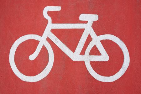 Bicycle lane sign, white sign on a red background.の写真素材