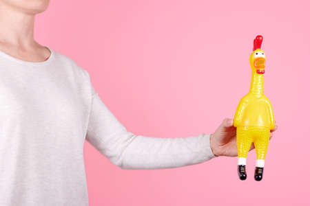Funny rubber toy chicken with open mouth.の写真素材