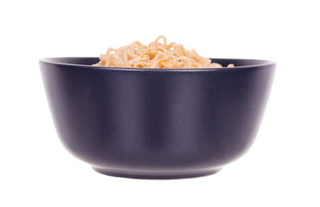 Asian instant noodle in dark bowl.の写真素材