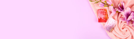 Spa concept idea,towel and soap composition on purple background.