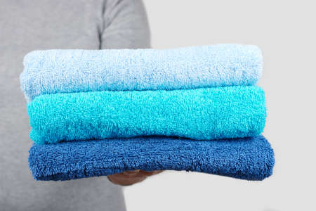 Hand with blue cotton towel.の写真素材