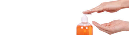 Orange liquid soap in a bottle. High quality photoの写真素材