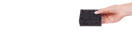 Black sponge for daily cleaning and washing up. High quality photoの写真素材