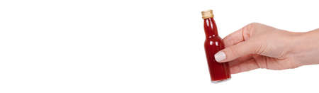 Spicy red sauce in a glass bottle. High quality photoの写真素材