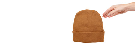 Brown wool winter hat isolated on white.