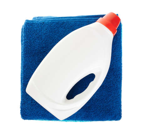 Detergent in bottle with cotton towels isolated on whiteの写真素材