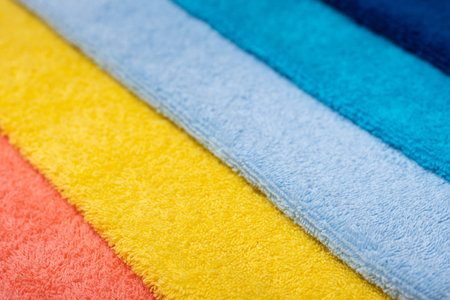 Composition of colored cotton towels. The concept of softness and purity