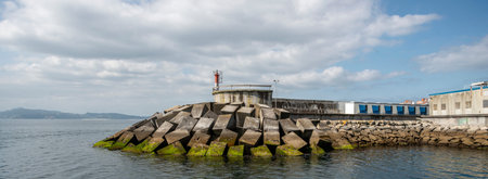 Breakwater with signal lighthouse in the pontevedra estuary of galicia, spain