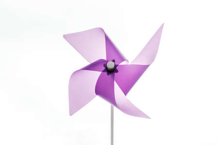 Purple static pinwheel with white background.の写真素材
