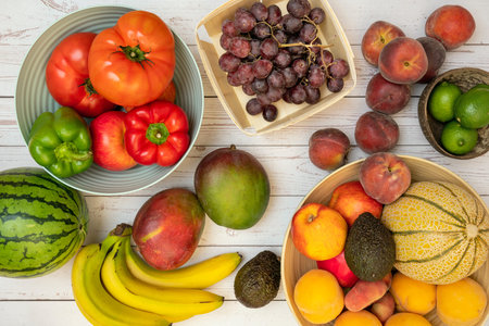 Image of fruits and vegetables in fruit bowls or on the table. Ripe bananas, melons and watermelons,...