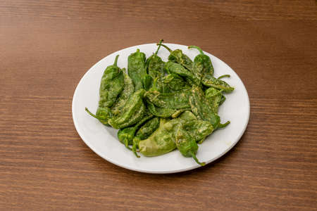 Fried green peppers with salt typical of northern Spain. PadrÃ³n peppers, some hot and others not.の写真素材